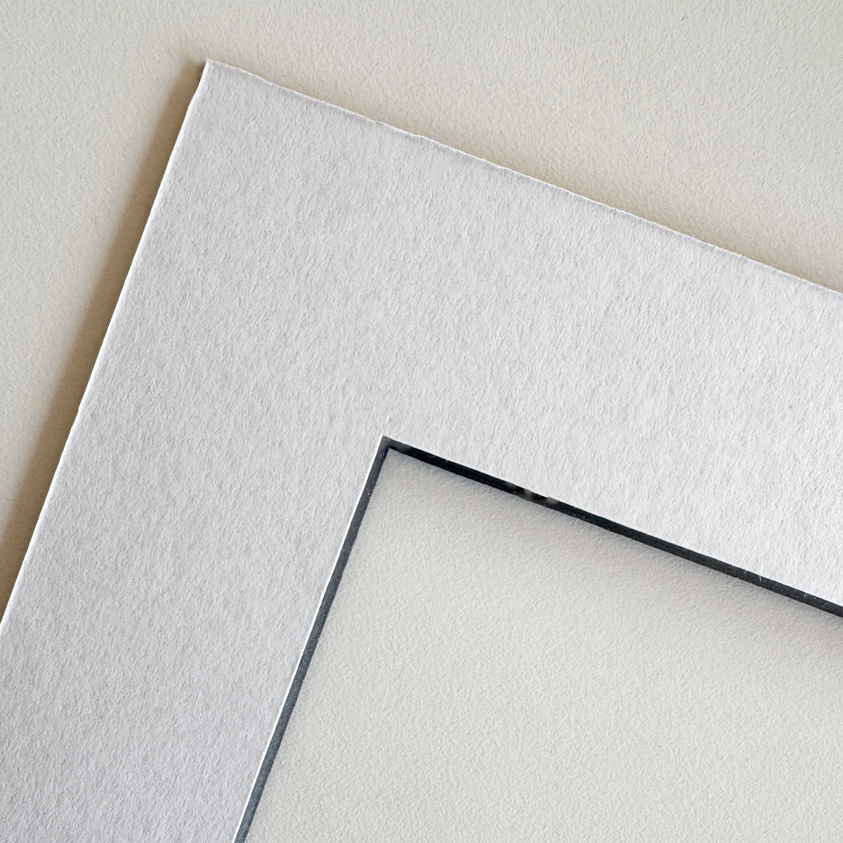 White passepartout with black core
